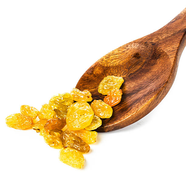Yellow Shiny Raisins isolated on white background