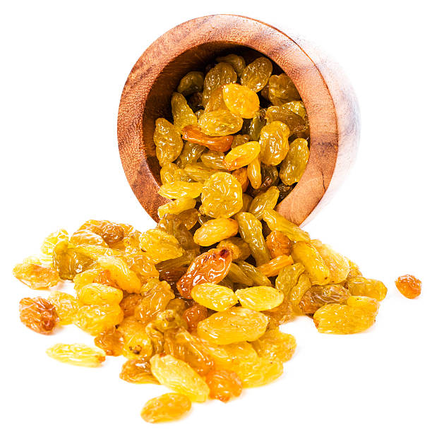 Yellow Shiny Raisins isolated on white background