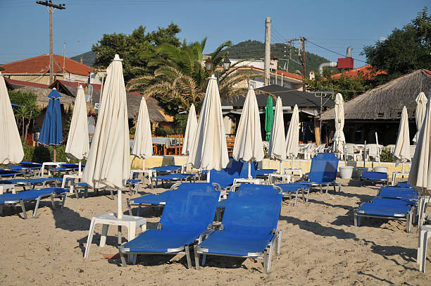 istock sandy beach with sunbeds in the Greek 186554663