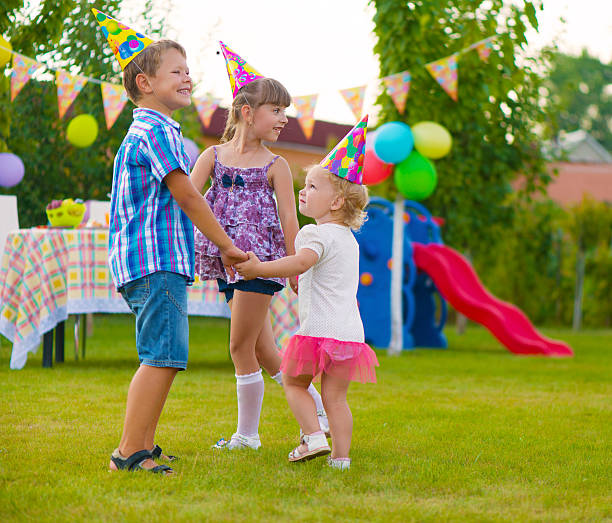 istock Three little kids dancing roundelay 186555228