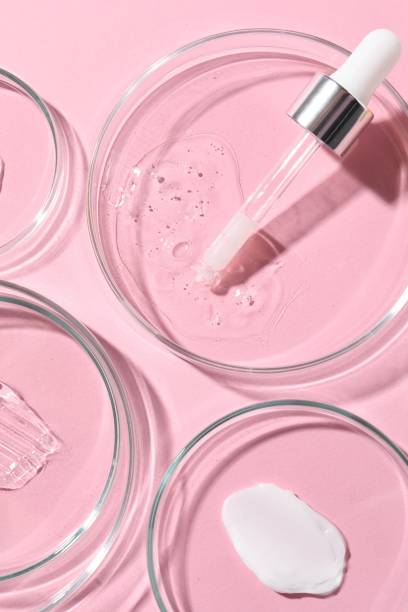 istock Pipette, cosmetic serum and petri dishes with samples on pink background, flat lay 1865560229