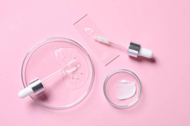 istock Pipettes, cosmetic serum and petri dishes with samples on pink background, flat lay 1865567115