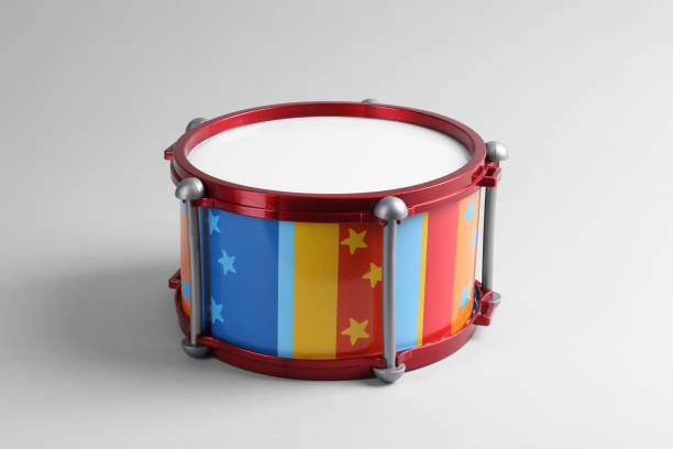 istock Colorful drum on light background. Percussion musical instrument 1865573029