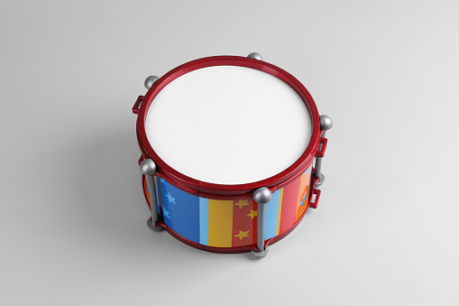 Colorful drum on light background. Percussion musical instrument