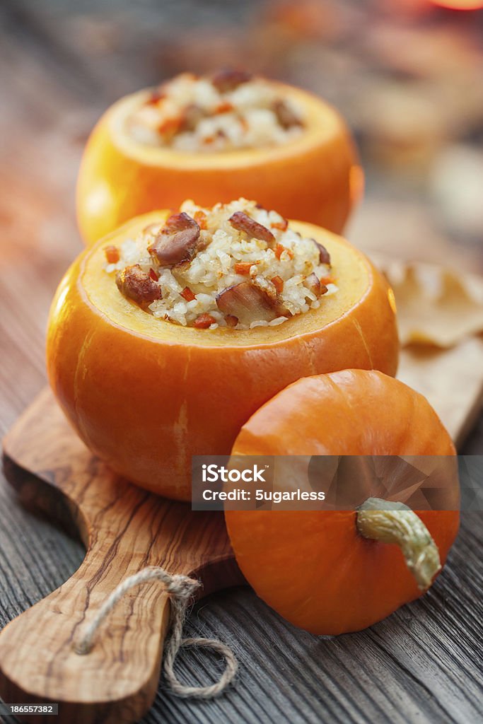 Roasted stuffed pumpkins Roasted little pumpkins stuffed with chicken meat, vegetables and rice Pumpkin Stock Photo