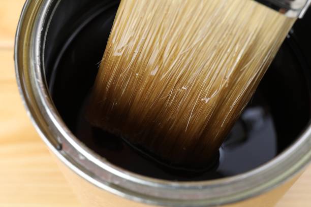 istock Dipping brush into can with varnish, closeup 1865574618