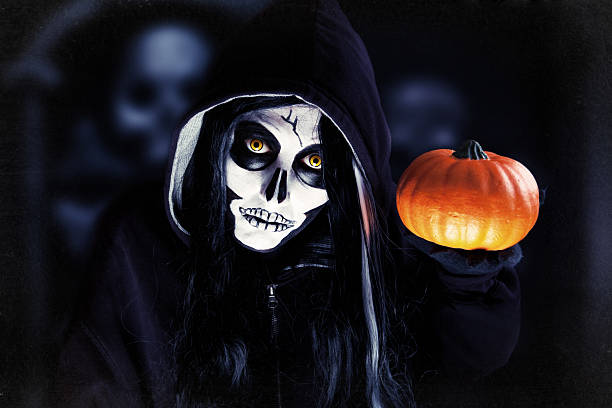 Creepy Halloween Skeleton Holding Pumpkin