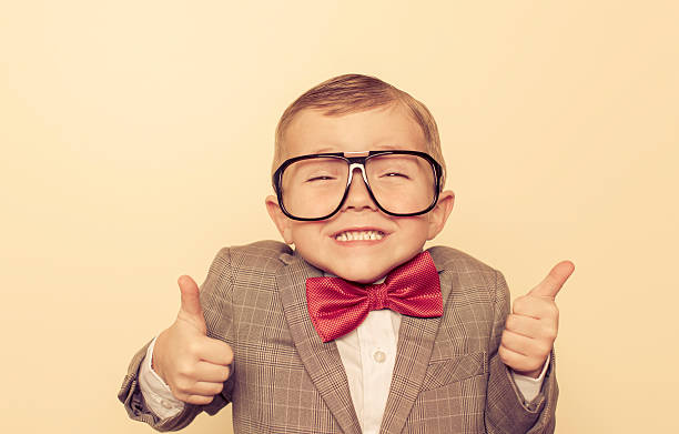 It's All Good A young boy nerd is large and in charge and everything is okay. nerd kid stock pictures, royalty-free photos & images