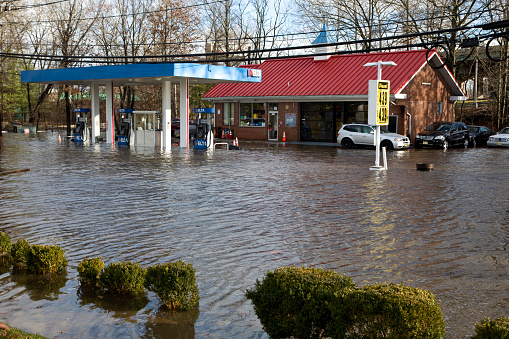 Elmwood Park, New Jersey, USA - December 18, 2023: Gas station inundated with flooding after heavy rains.