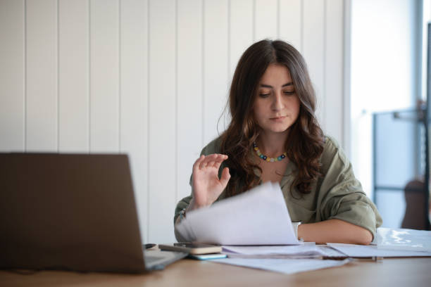istock Young confident smiling businesswoman, successful entrepreneur working in modern office 1865580871