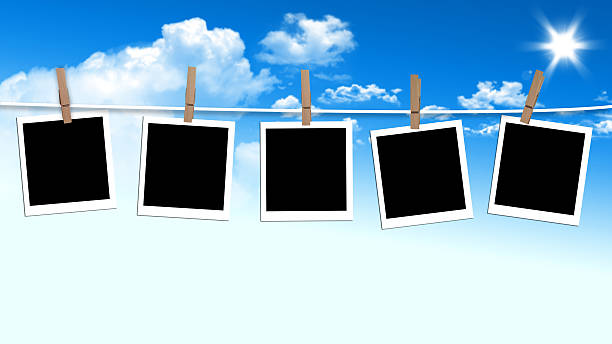 istock Photos frames hanging in the rope on a sky 186559204