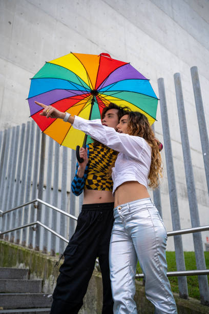 Valencia-Spain. 03/25/2024. Overhead view of a person walking in a rainy day using umbrella
