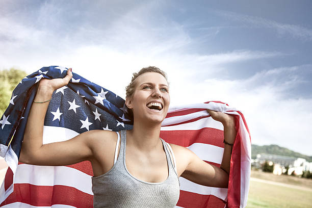 istock Beautiful US athlete with national flag 186560749