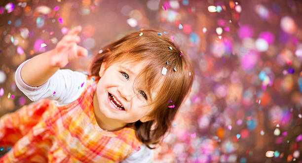 istock Confetti Falling On Little Girl 186560771