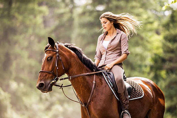 istock Woman enjoying while horseback riding. 186560955