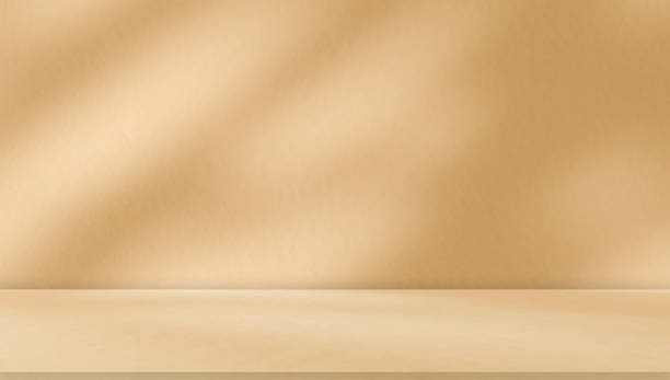 istock Empty brown beige golden room studio with sunlight effect shadow of leaves. 1865640039