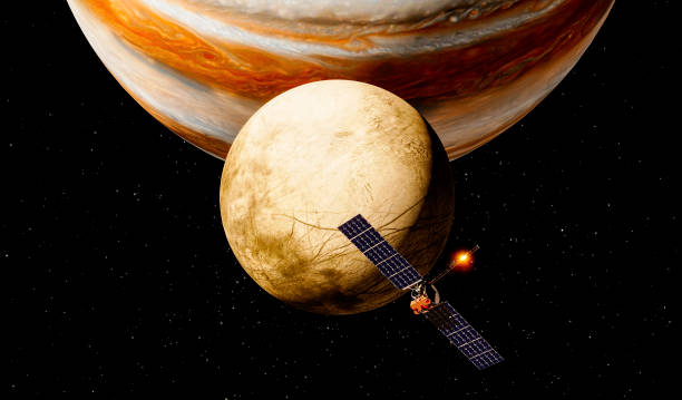 Clipper spacecraft on a flyby over Europa’s surface with Jupiter rising in the background. 3d rendering. Element of this image are furnished by Nasahttps://nasa3d.arc.nasa.gov/detail/jup0vss1