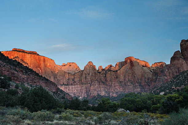 istock Sunrise on the red cliffs of Zion 186565103
