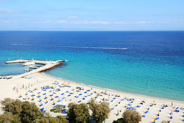 istock Sunbeds on a beach and turquoise water 186565734