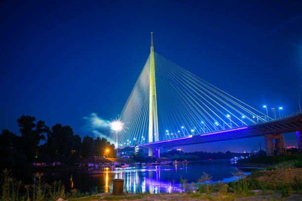 istock Illuminated bridge at night cityscape with fireworks 1865657588