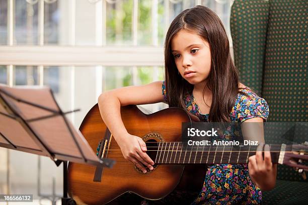 Learning How To Play The Guitar Stock Photo - Download Image Now - Beautiful People, Beauty, Brown Hair