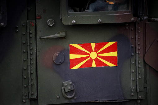 Bucharest, Romania - December 01, 2023: Flag of North Macedonia on an army Humvee. This image is for editorial use only.