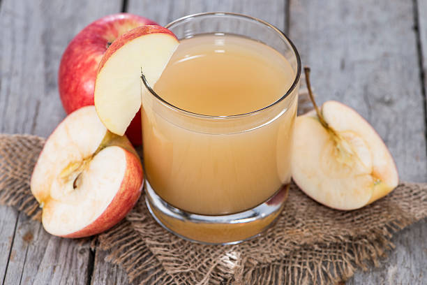 istock Small Glass with fresh Apple Juice 186567272