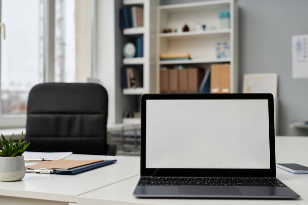 istock Part of Office Interior with Laptop on Desk 1865673987