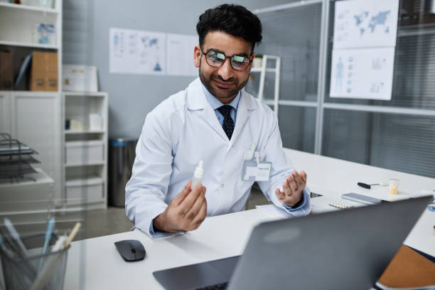istock Young Muslim Male Ophthalmologist Showing Eye Drops 1865674548