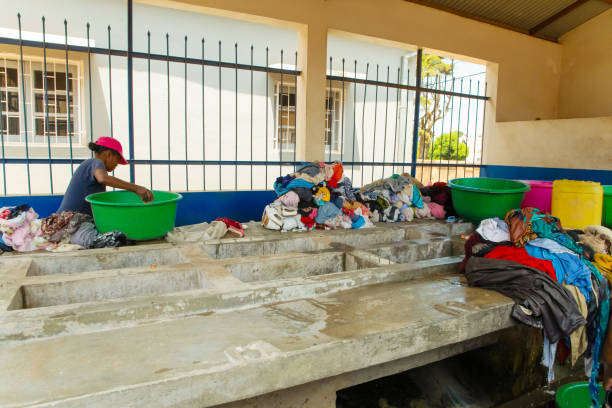 Antananarivo, Madagascar. 25 oktober 2023. laundry in Antananarivo. concrete block with sinks near which women wash clothes. piles of washed wet clothes