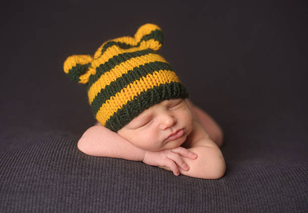 istock Sleeping Newborn Boy in Knit Hat 186567843