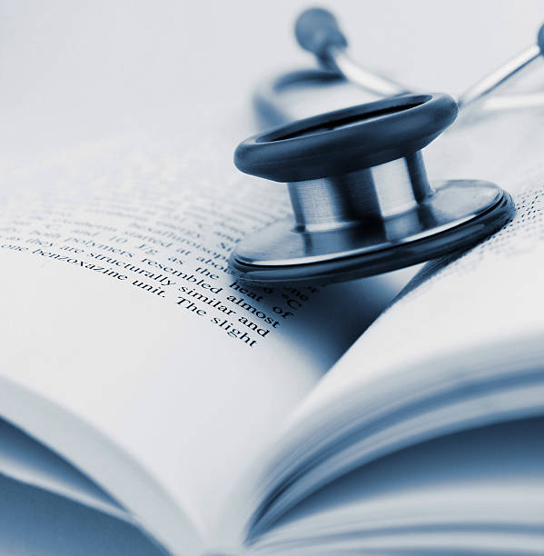 istock A close-up of a stethoscope resting on an open book 186569069