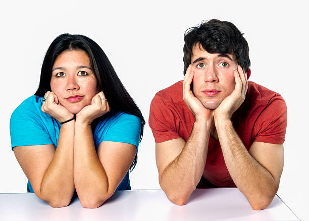 istock Diverse Couple with Head in Hand Isolated on White 186569158