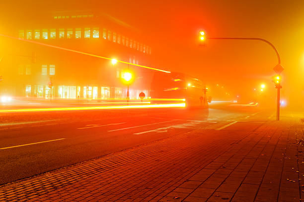 istock Traffic on a foggy intersection 186569548