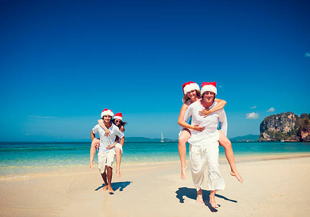 istock Happy young couples having fun on the beach 186569600