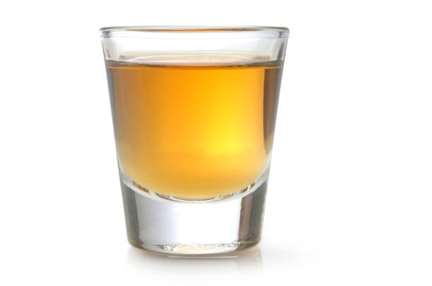 Tequila Shot Glass of Alcohol on White. shot glass stock pictures, royalty-free photos & images