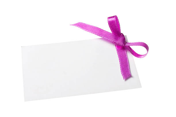 istock Blank gift tag tied and purple satin ribbon. 186571708