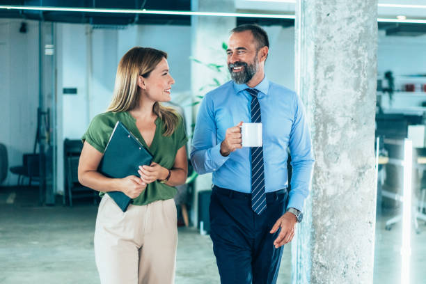 istock Business colleagues talking in the office 1865717329