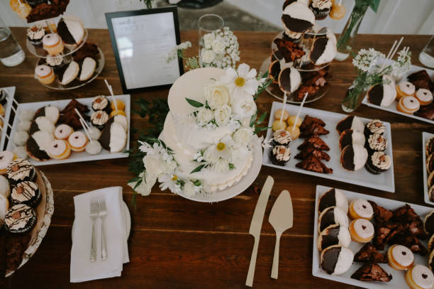 Luxurious desert table with cake, cookies, and cupcakes