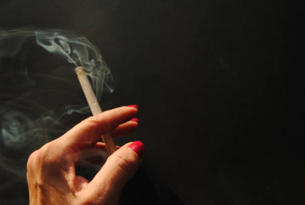 istock Women smoke a cigarette 1865730051