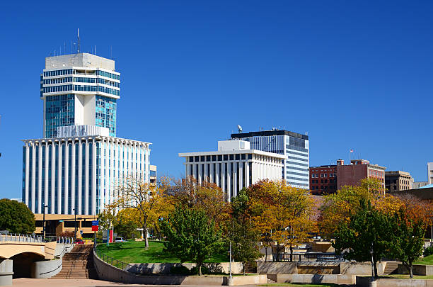 Autumn Skyline of Empty Downtown Wichita, Kansas Wichita, Kansas downtown skyline during Autumn, with Autumn trees in the foreground. wichita photos stock pictures, royalty-free photos & images