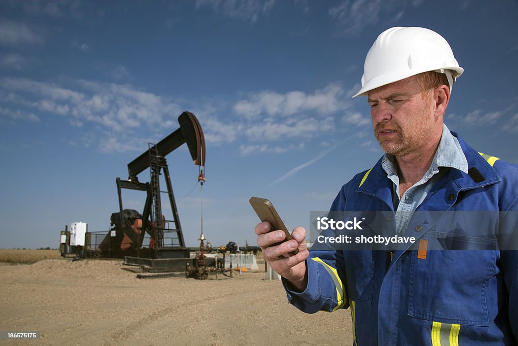 SMS trabajador del petróleo - Foto de stock de Accesorio de cabeza libre de derechos