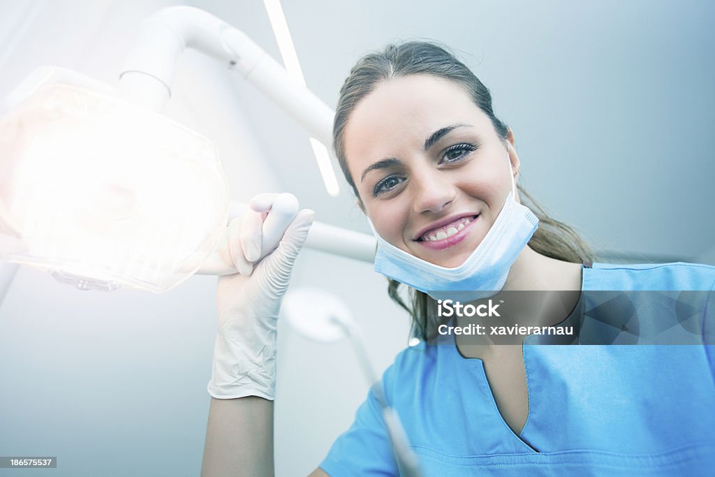 Dental Hygiene Dentist checking the patient teeth. Dental Assistant Stock Photo