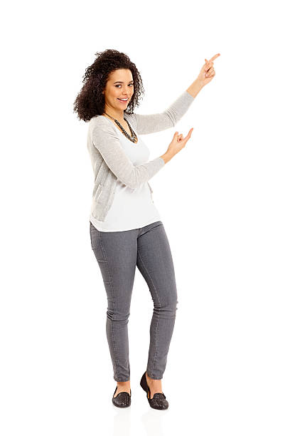 istock Young African lady pointing at coy space over white 186577320