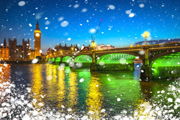 istock Big Ben clock tower in London sundown winter snow view from Thames river 1865787184