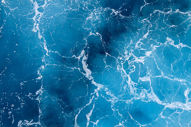Deep Blue Sea High angle view of ocean waves. sea wake stock pictures, royalty-free photos & images