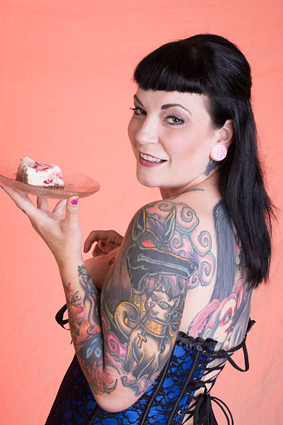 istock Mid adult pinup model smiling with cheesecake. 186579064