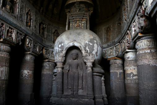 A buddihst statue is carved at the Ajanta Caves in Aurangabad district of Maharashtra, India, where about 300 rock-cut Buddhist cave monuments date from the 2nd century BCE to about 480 or 650 CE.