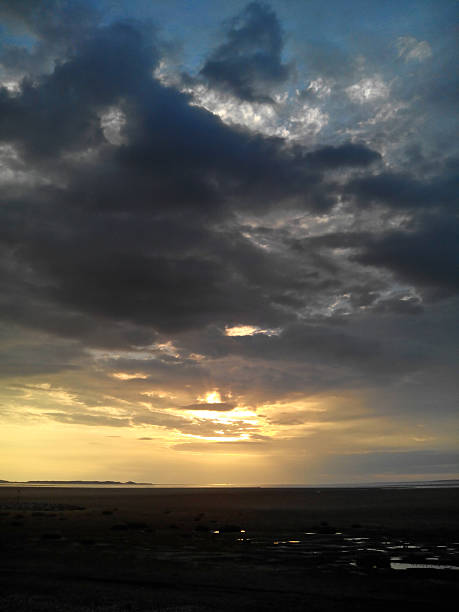 istock Sunset over estuary with tide coming in 186579268