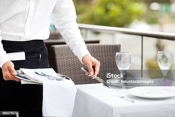 Waiter Setting The Table In Restaurant Stock Photo - Download Image Now - Setting The Table, Restaurant, Outdoors